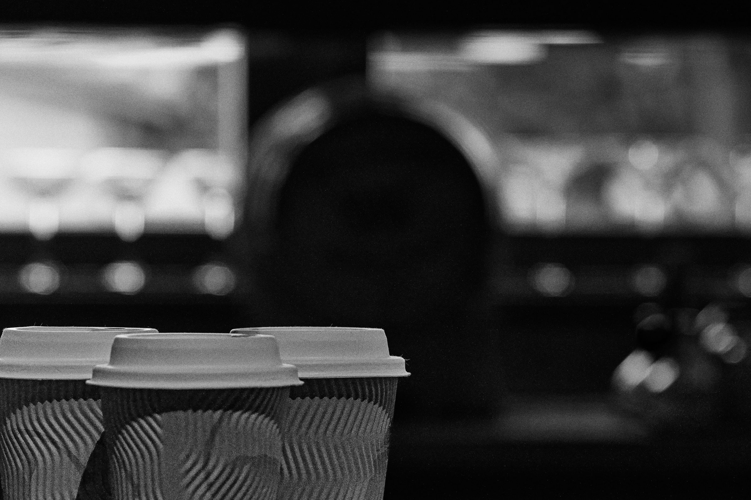 Three coffee cups on a table, a conversation about to begin