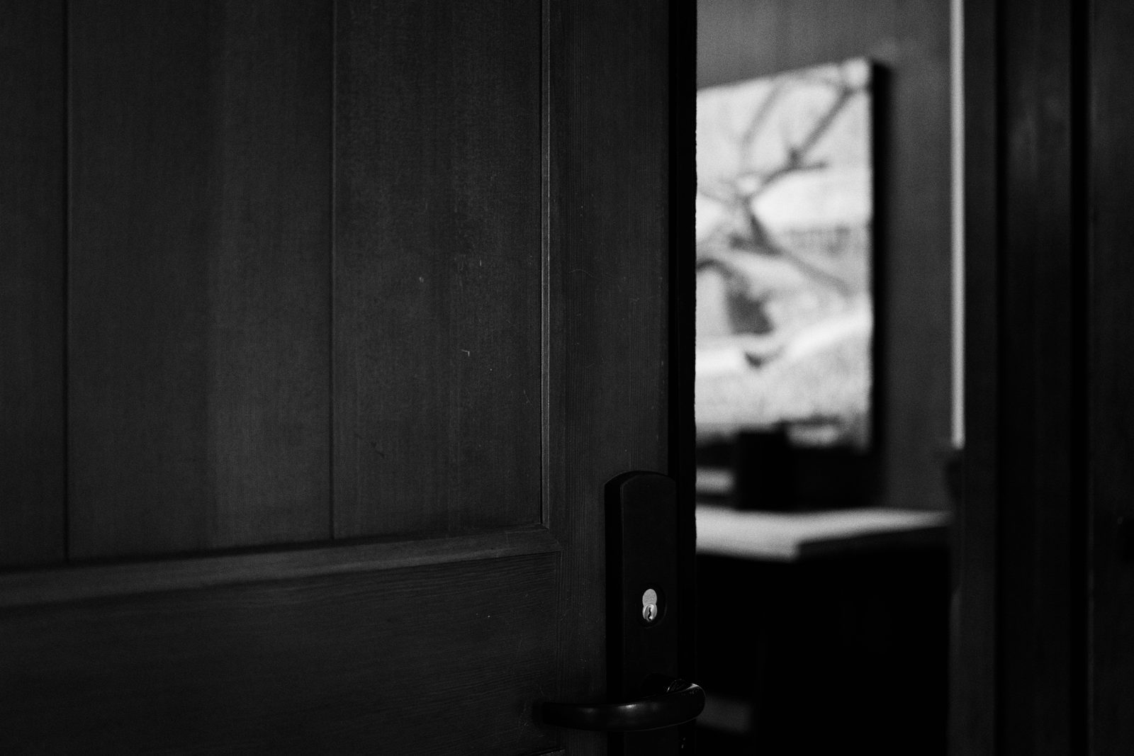 A door left open onto a private room